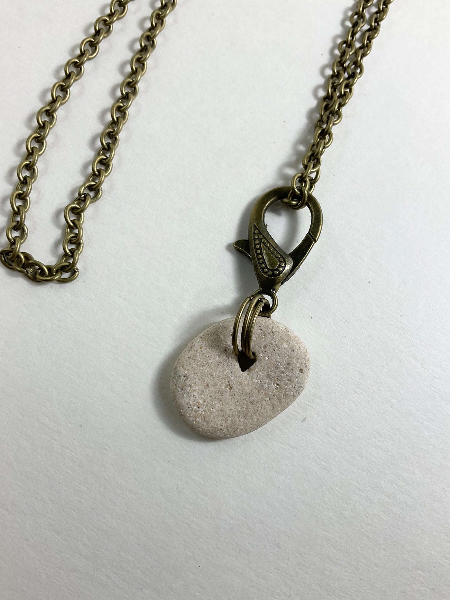 Holey Stone Necklace on bronze tone chain