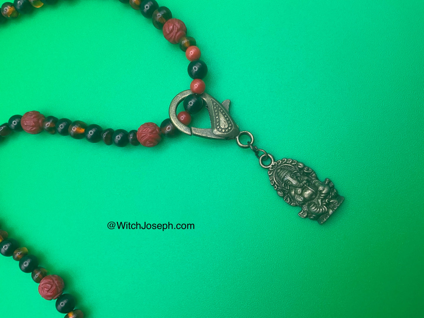 Ganesha Talisman with Amber and Jet and Red Coral Rose accents