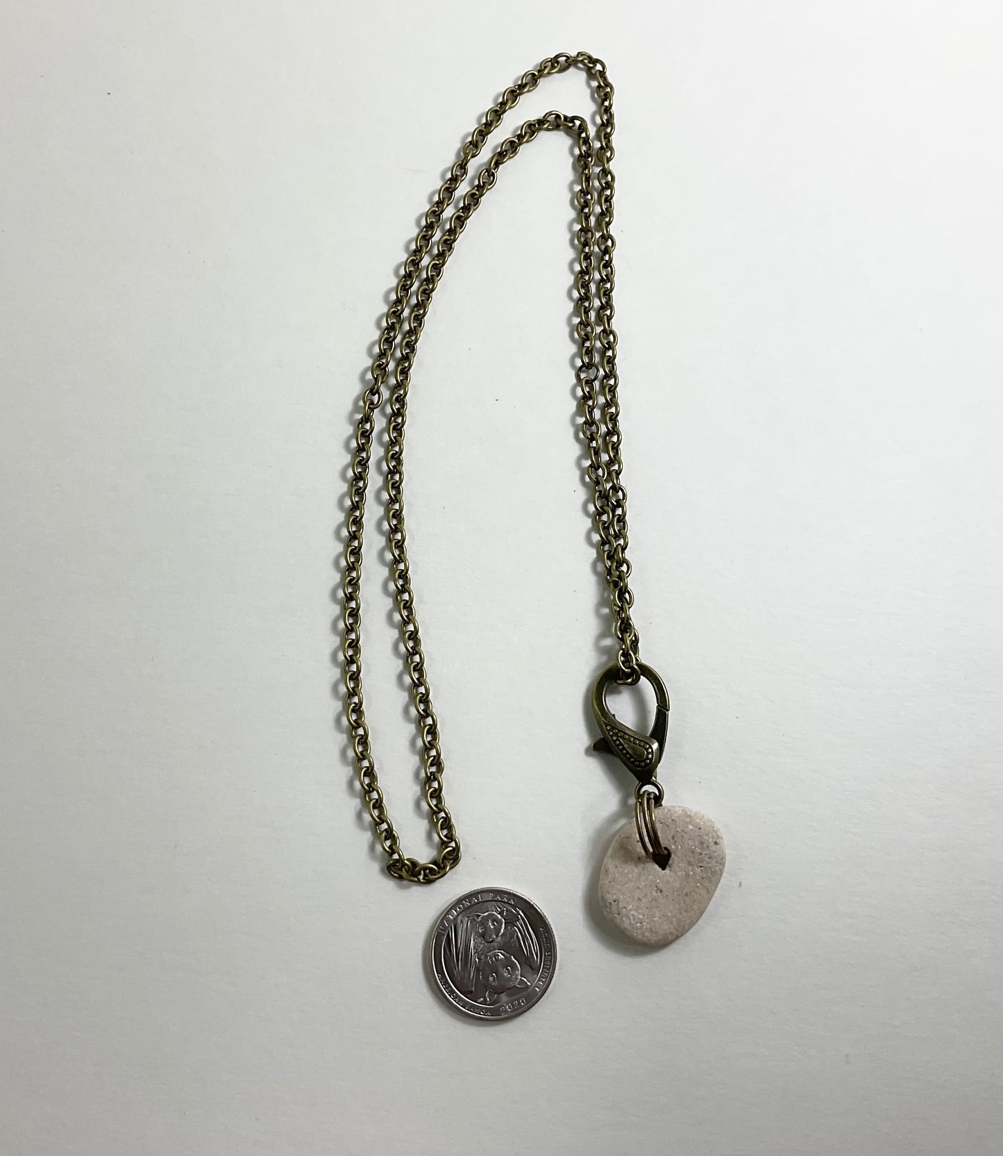 Holey Stone Necklace on bronze tone chain