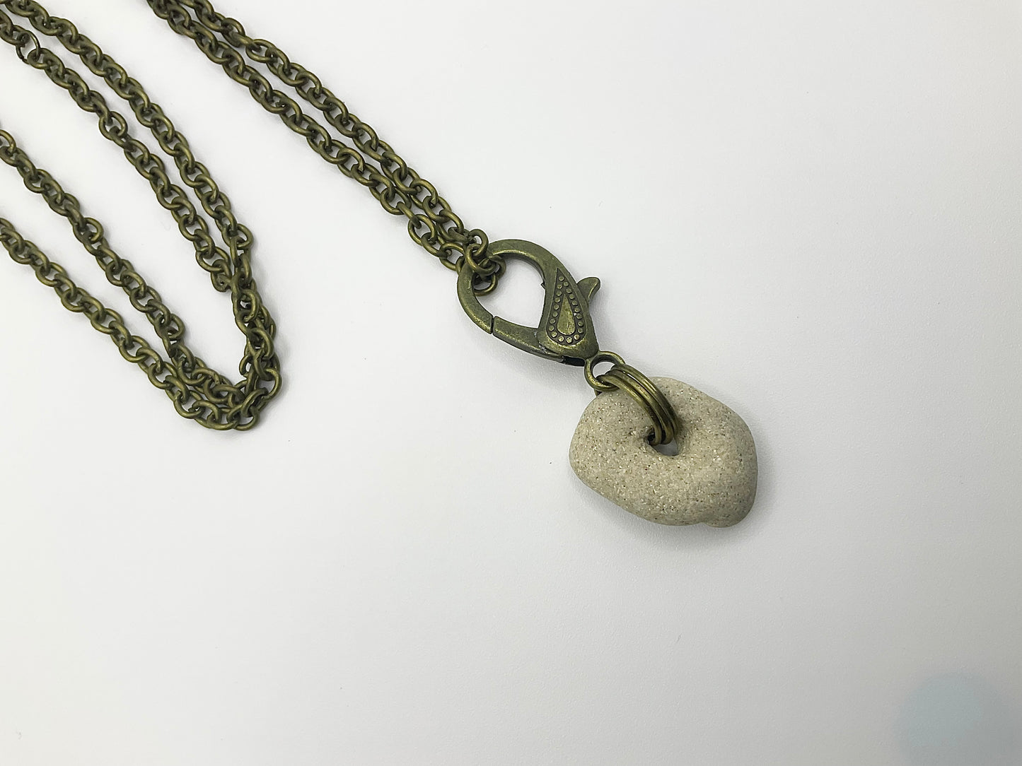 Holey Stone Necklace on bronze tone chain