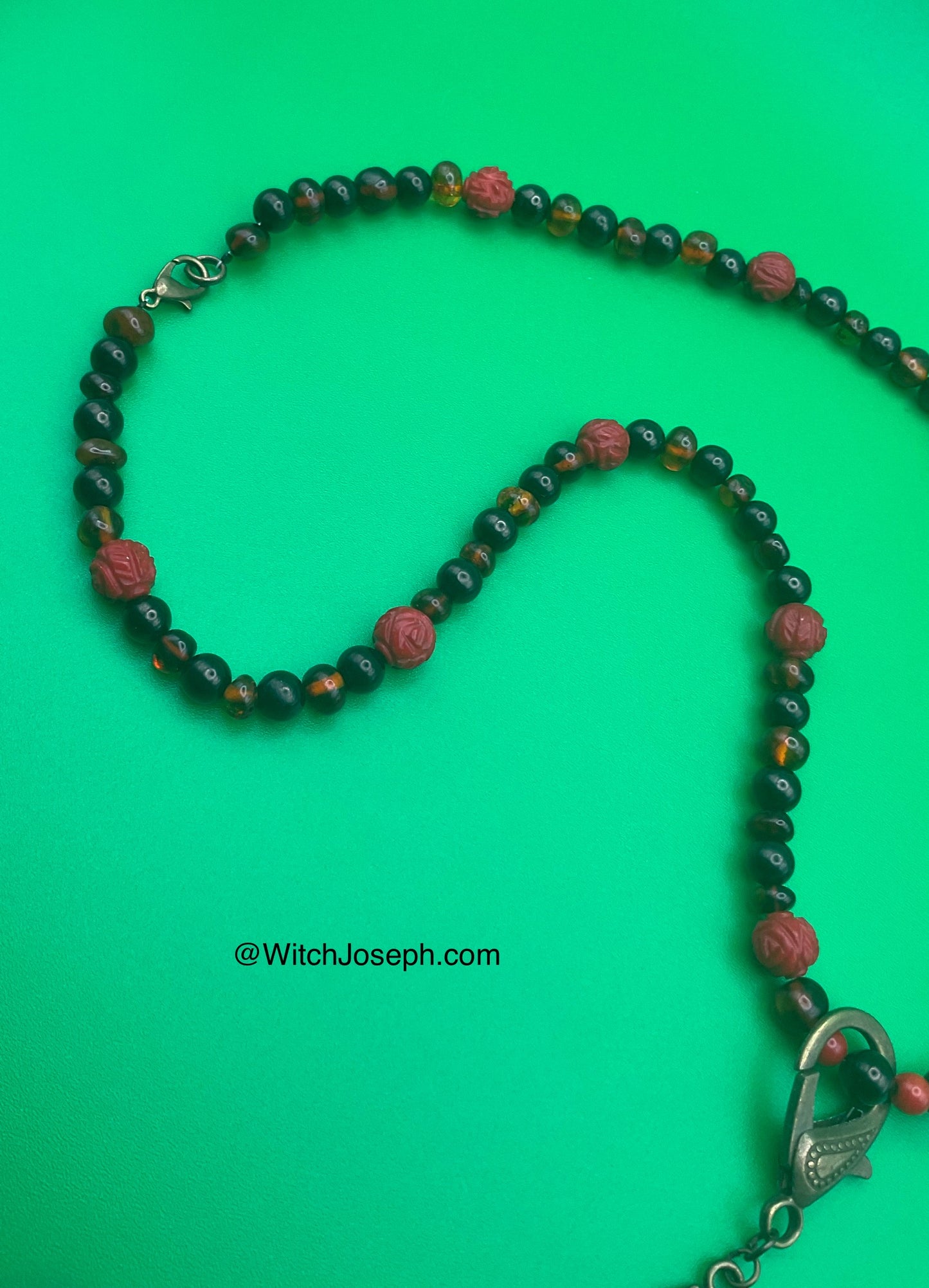 Ganesha Talisman with Amber and Jet and Red Coral Rose accents