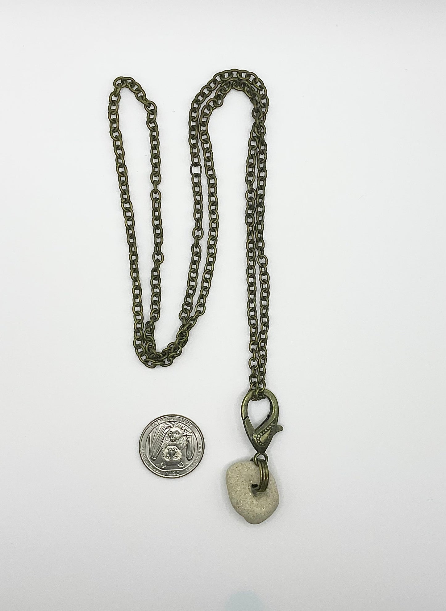 Holey Stone Necklace on bronze tone chain