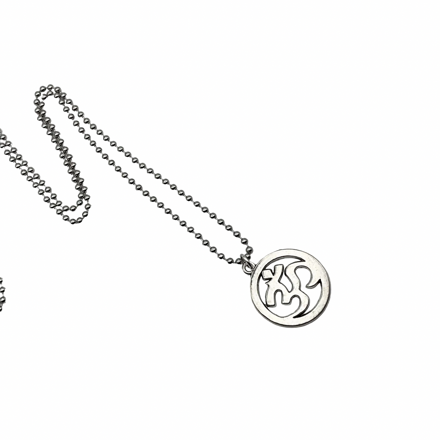 Silver tone necklace with a round AUM pendant on a white background