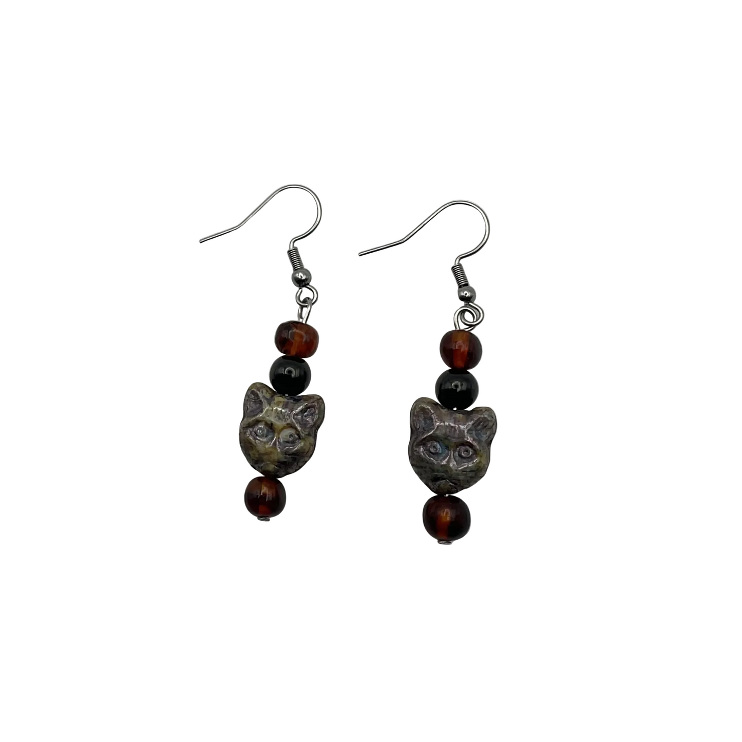 a pair of Goddess Bastet earrings featuring a cat head with amber and jet beads against a white background