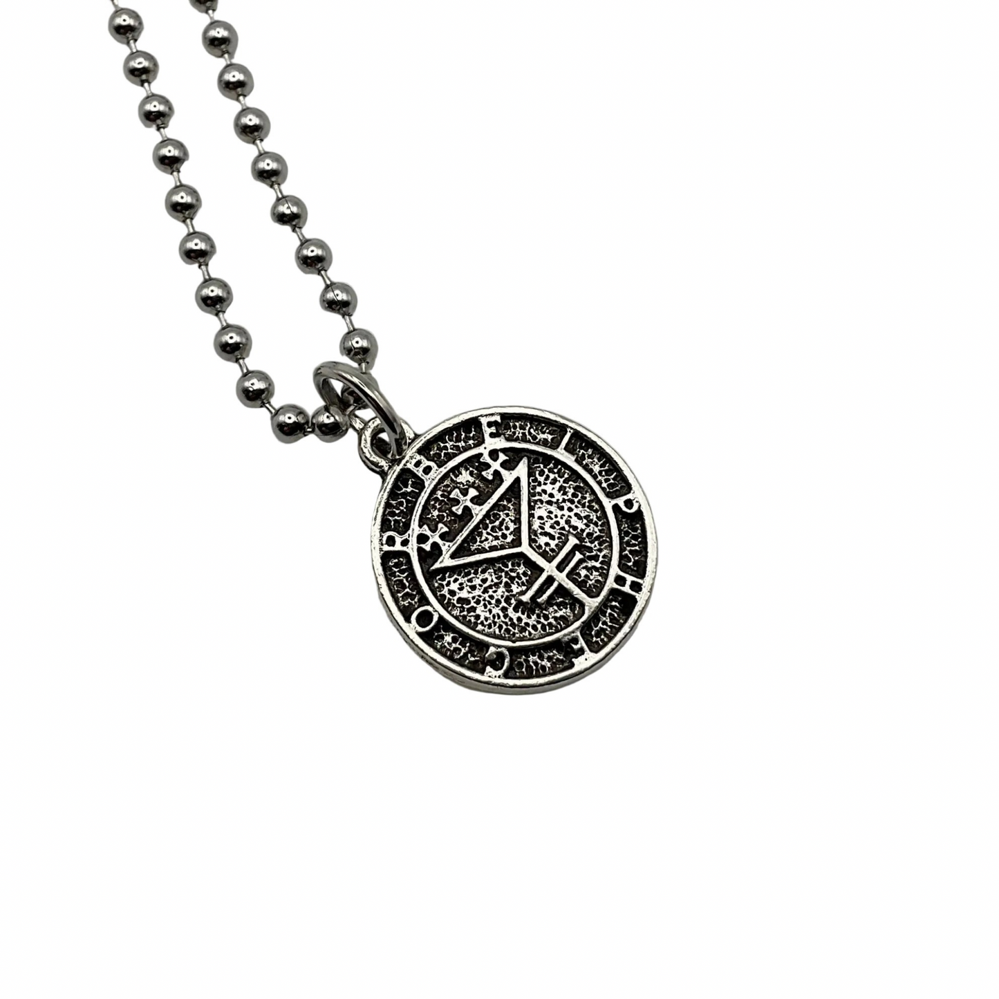 A silver tone round pendant with the sigil seal of Belphagor on it on a ball chain displayed against a white background