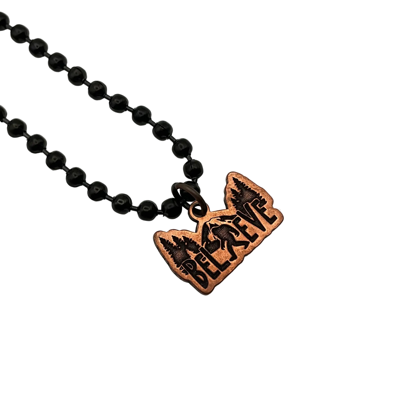 Necklace with a copper Bigfoot pendant that says 'BELIEVE' on a white background