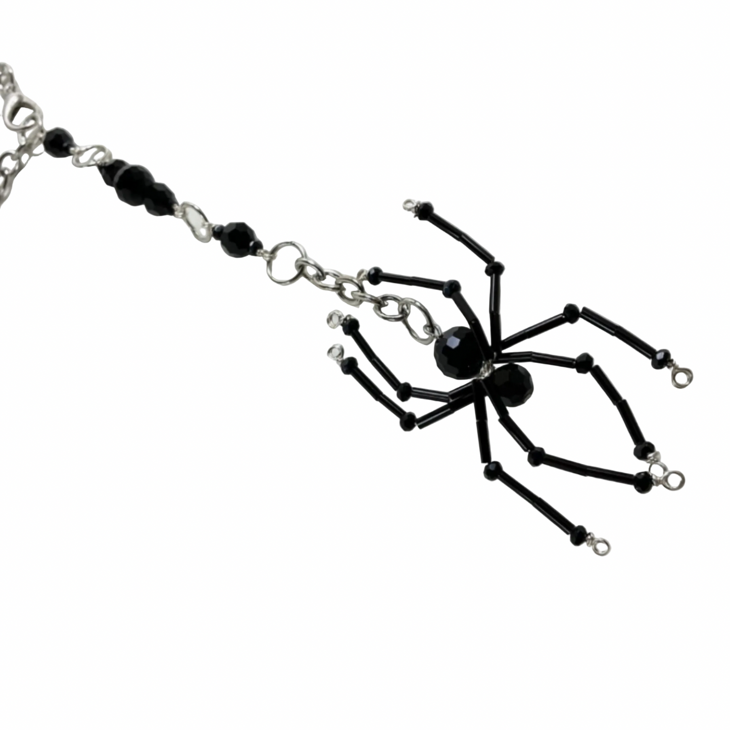 Black spider-shaped beaded Sun Catcher Car Charm on a chain against a white background