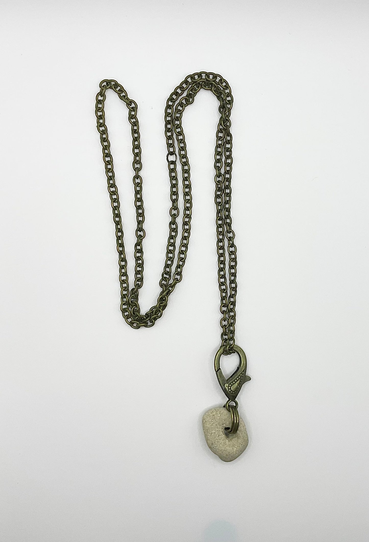 Holey Stone Necklace on bronze tone chain