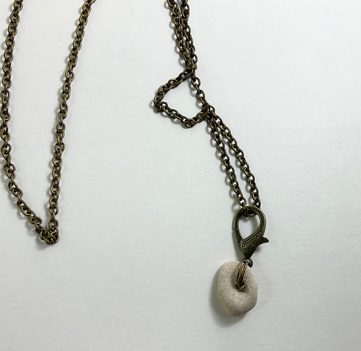 Holey Stone Necklace on bronze tone chain