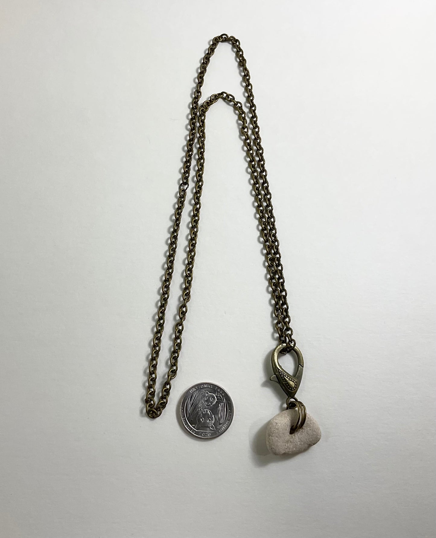 Holey Stone Necklace on bronze tone chain