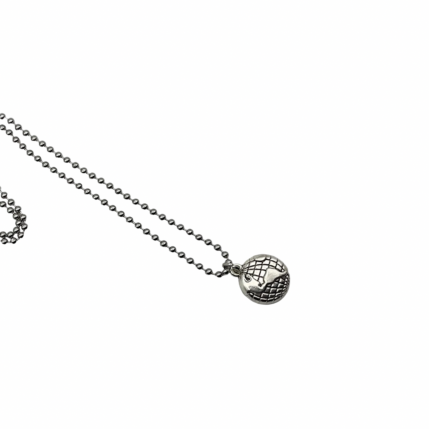 Silver tone necklace with a spherical earth globe pendant on a white background
