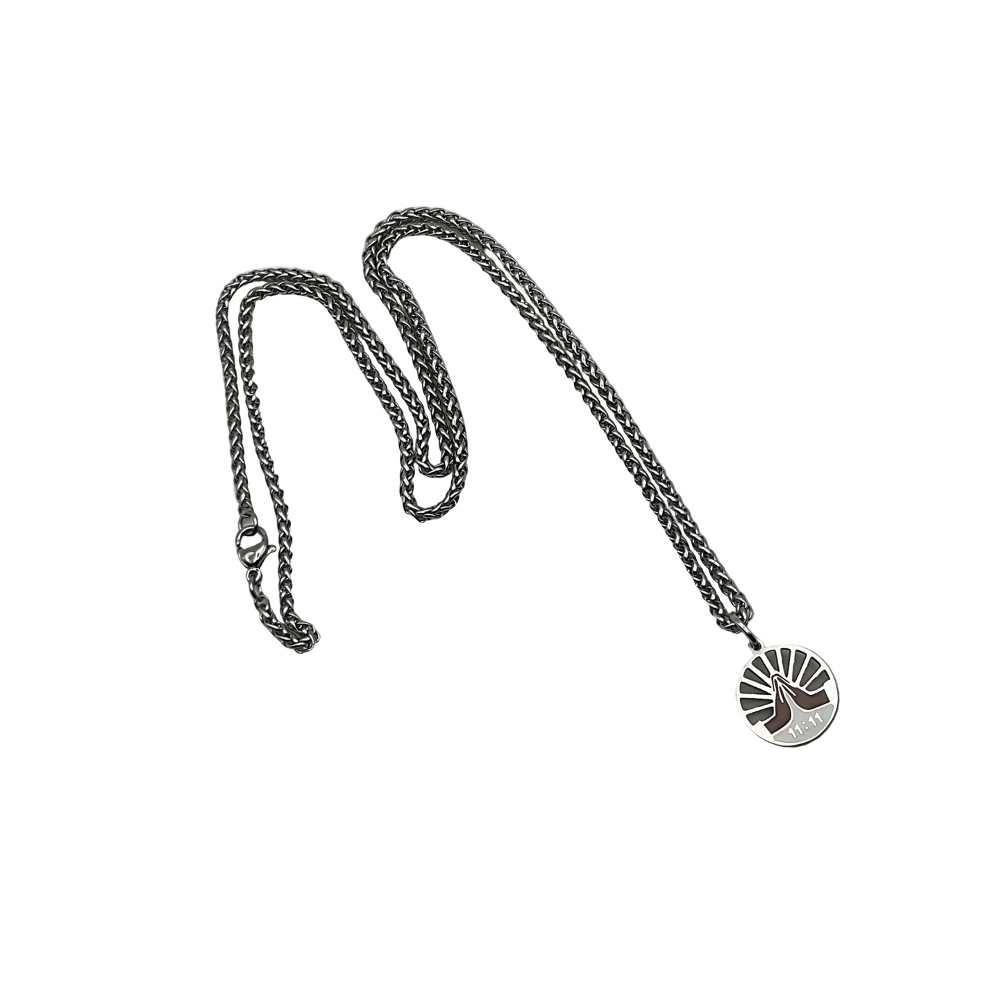 Silver tone chain necklace with a circular 11 11 pendant with praying hands on a white background