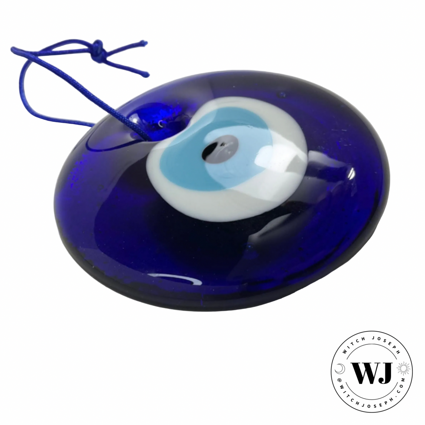 Blue glass evil eye glass ornament with a white and blue design displayed on a white background