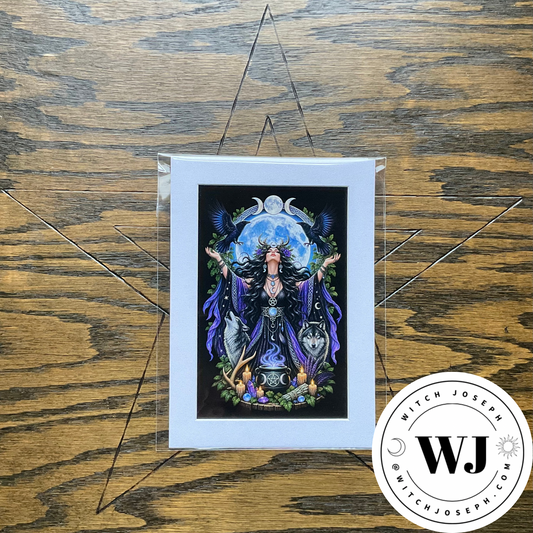 A matted art print featuring a witch-like figure with outstretched arms in front of a glowing moon, displayed on a wooden surface with a clear protective sleeve. A circular 'Witch Joseph' brand watermark is visible in the bottom right corner.