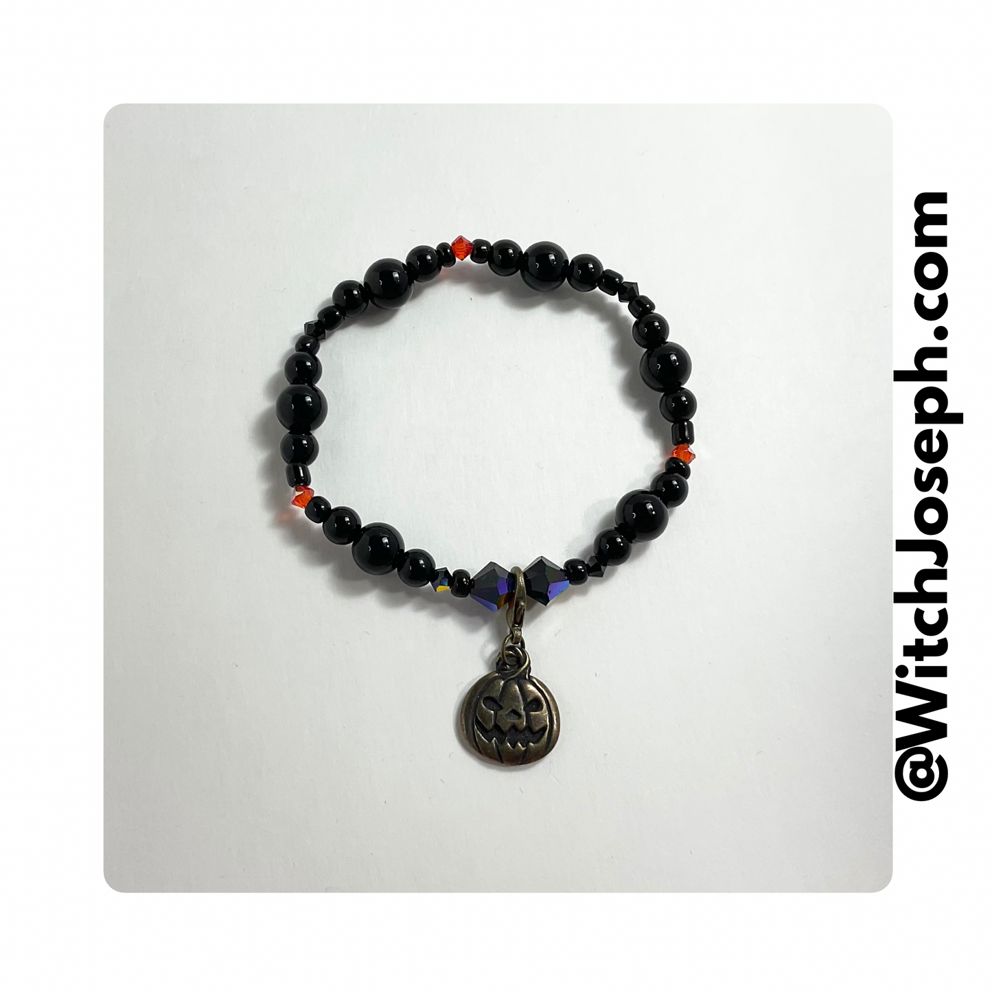 Jack o Lantern stretch bracelet displayed against a light background with the Witch Joseph URL
