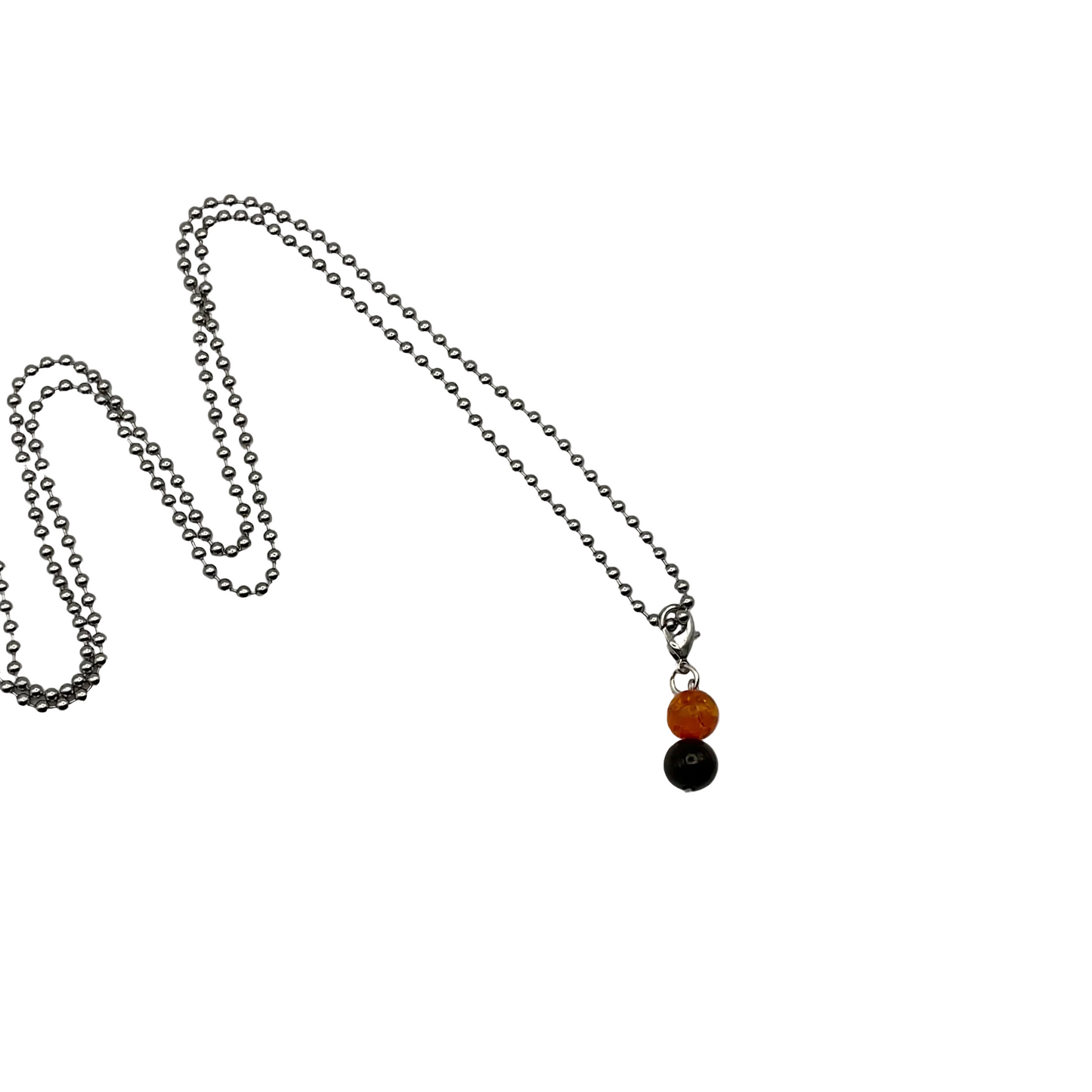 Necklace with one amber bead and one jet bead charm on a ball chain shown on a white background