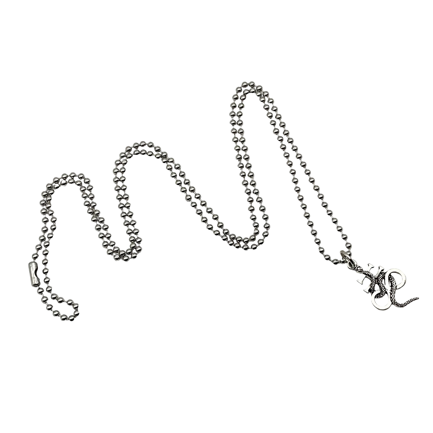 Silver tone necklace with a small Lucifer cross pendant with serpent on a white background.