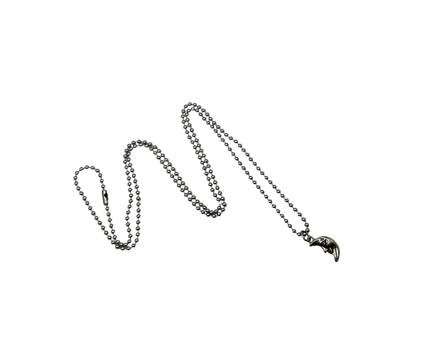 Silver tone chain necklace with a small man in the moon pendant on silver tone ball chain against a white background