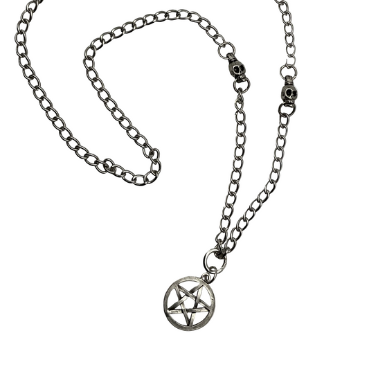 Silver tone chain necklace with a pentagram pendant with silver tone skull bead accents on a white background