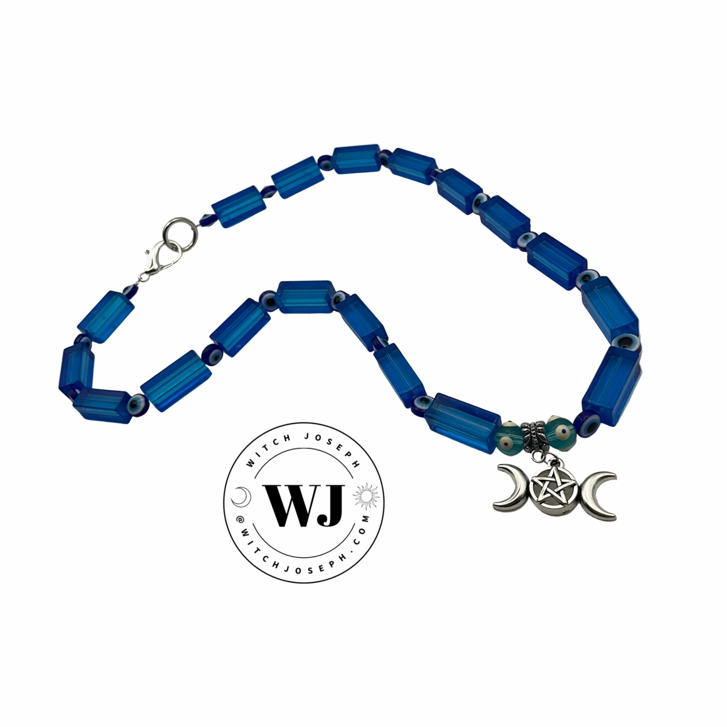 Blue beaded necklace with a silver triple Goddess pendant on a white background, featuring the brand 'Witch Joseph'.