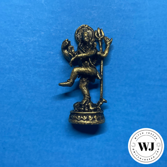 Small brass Shiva statue on a blue background with 'WJ' logo in the corner.
