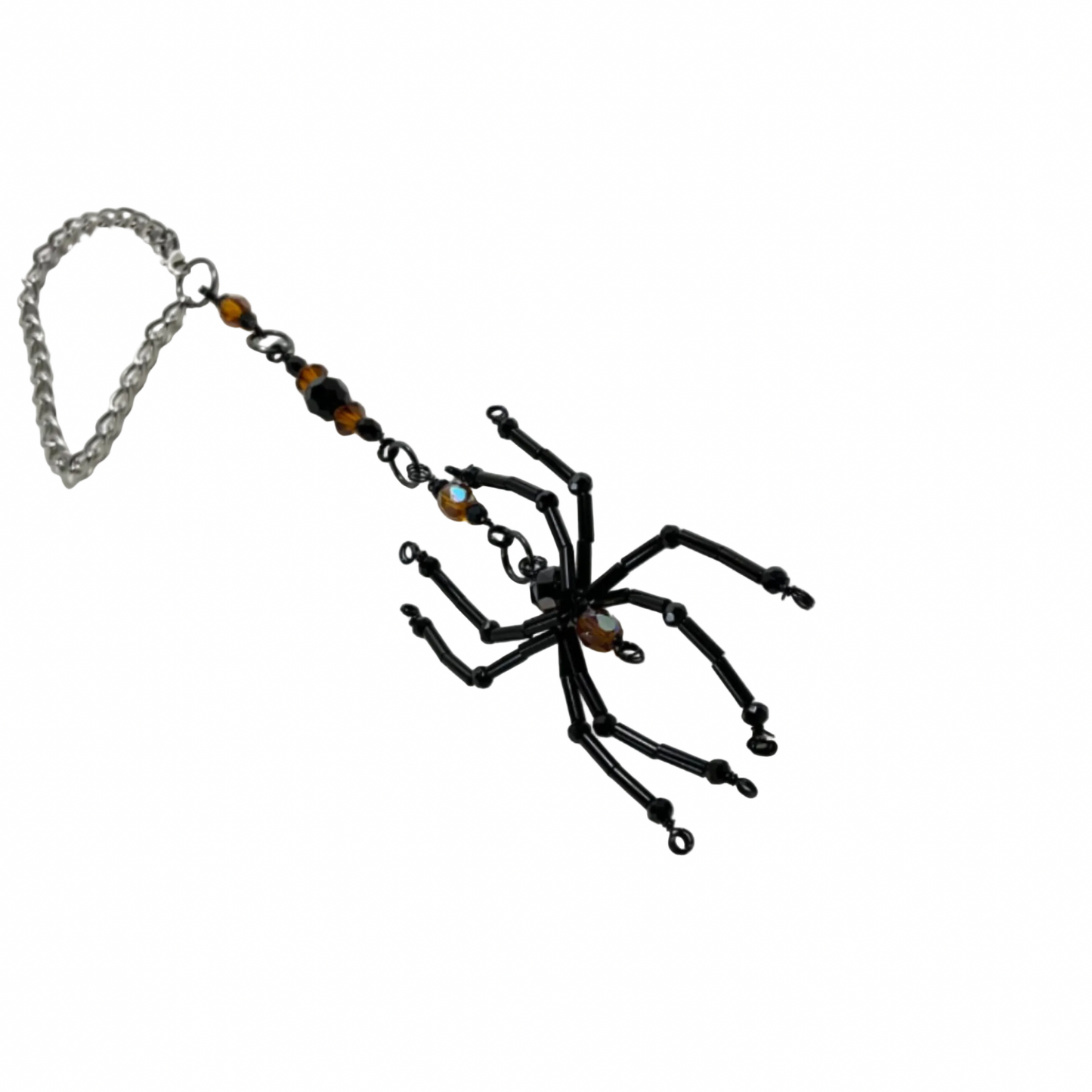 Black spider-shaped Sun Catcher with Orange bling accent beads on a chain against a white background