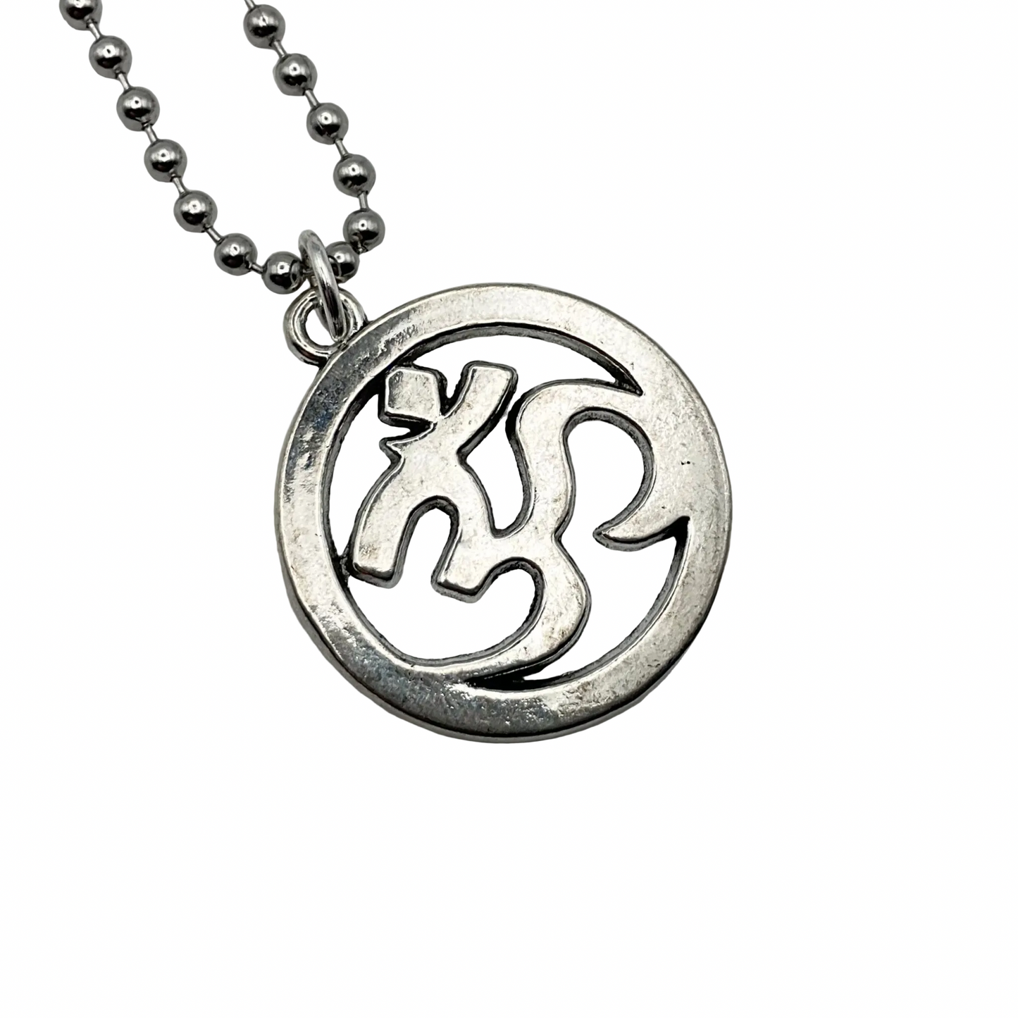 Silver tone AUM necklace on a silver tone ball chain against a white background