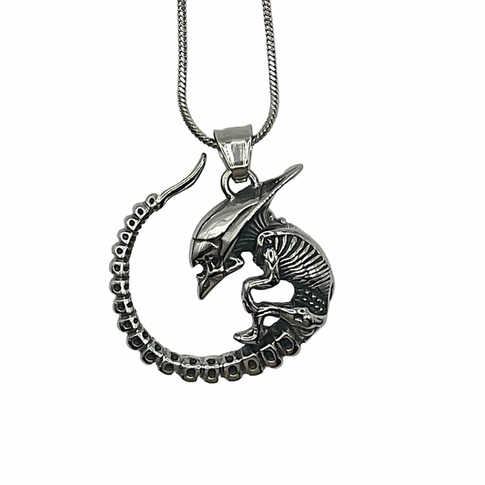 alien monster baby necklace in steel on a white background