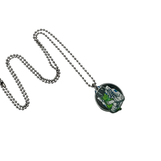 Necklace with a pendant featuring an astronaut with alien cat character design on a white background