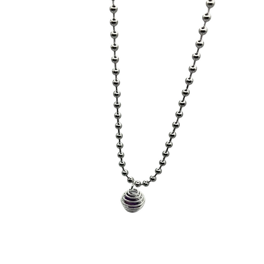 Silver ball chain necklace with an amethyst chip cage pendant on a light gray background