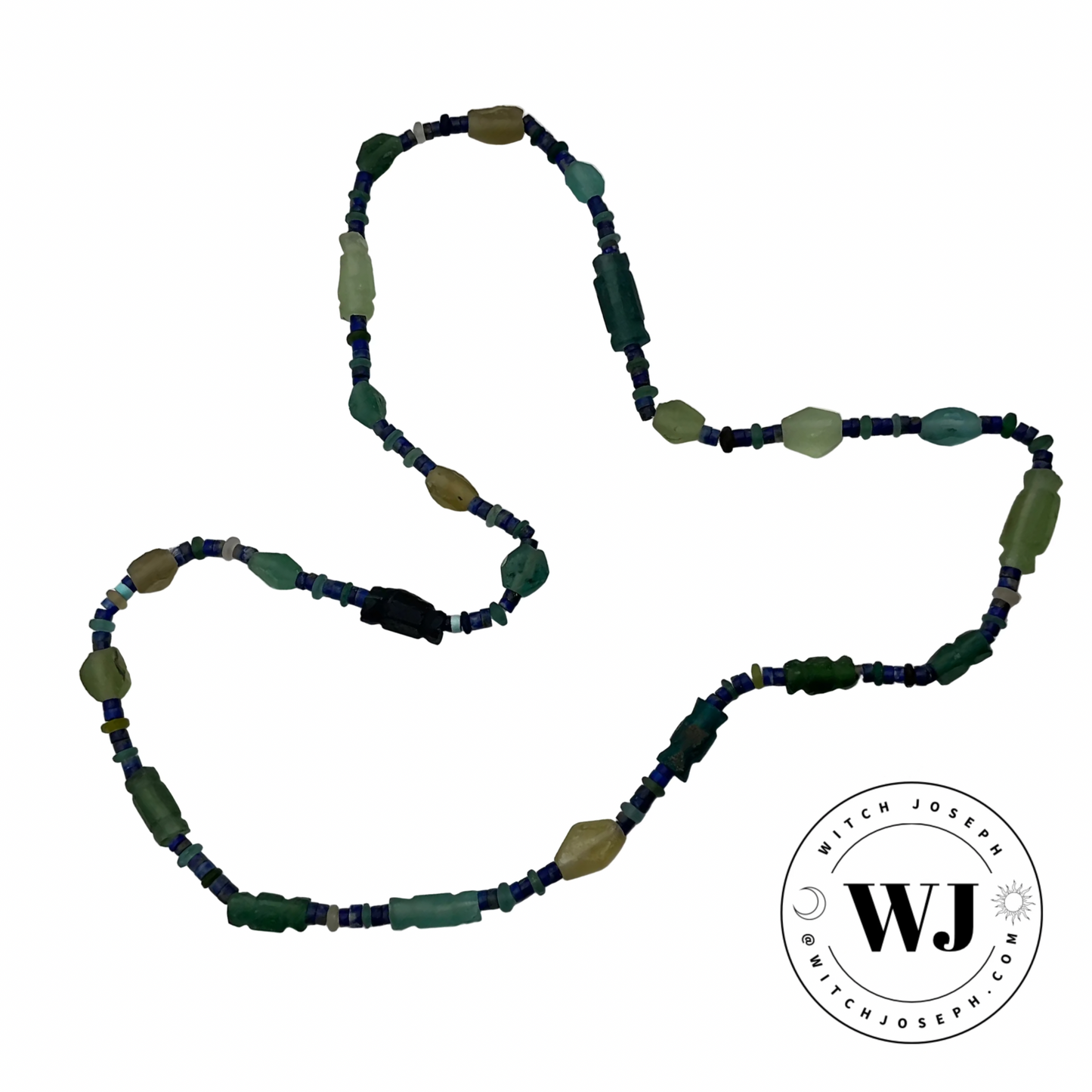 Beaded necklace with ancient Roman glass and lapis lazuli green and blue beads necklace displayed on a white background, featuring the logo 'Witch Joseph'.