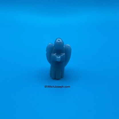 Blue angelite angel figure on a blue background with 'WitchJoseph.com' text.