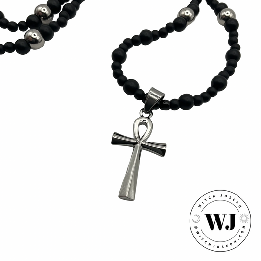Silver tone Ankh necklace with black and silver tone beads displayed against a white background with the Witch Joseph Logo