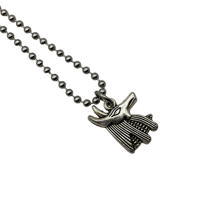 Silver Anubis bust charm necklace on a silver tone ball chain on a white background