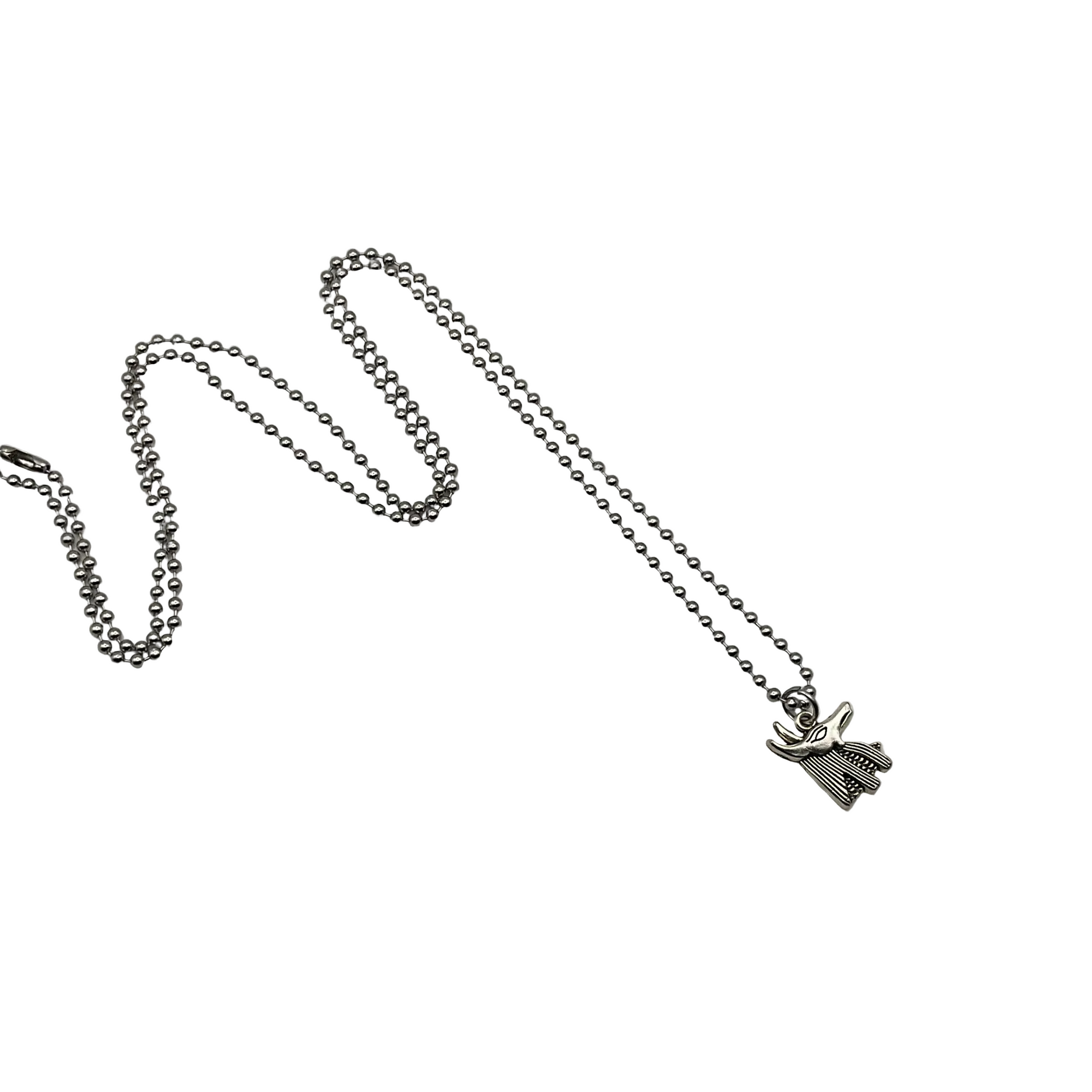 Silver necklace with a small Anubis bust charm pendant on a ball chain displayed on a white background