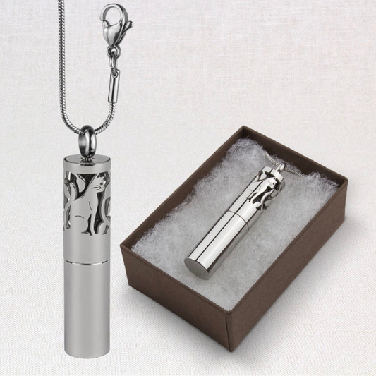 A photo of suns eye cat pendulum aromatherapy cat locket, shown hanging and also in a presentation gift box against a white background.