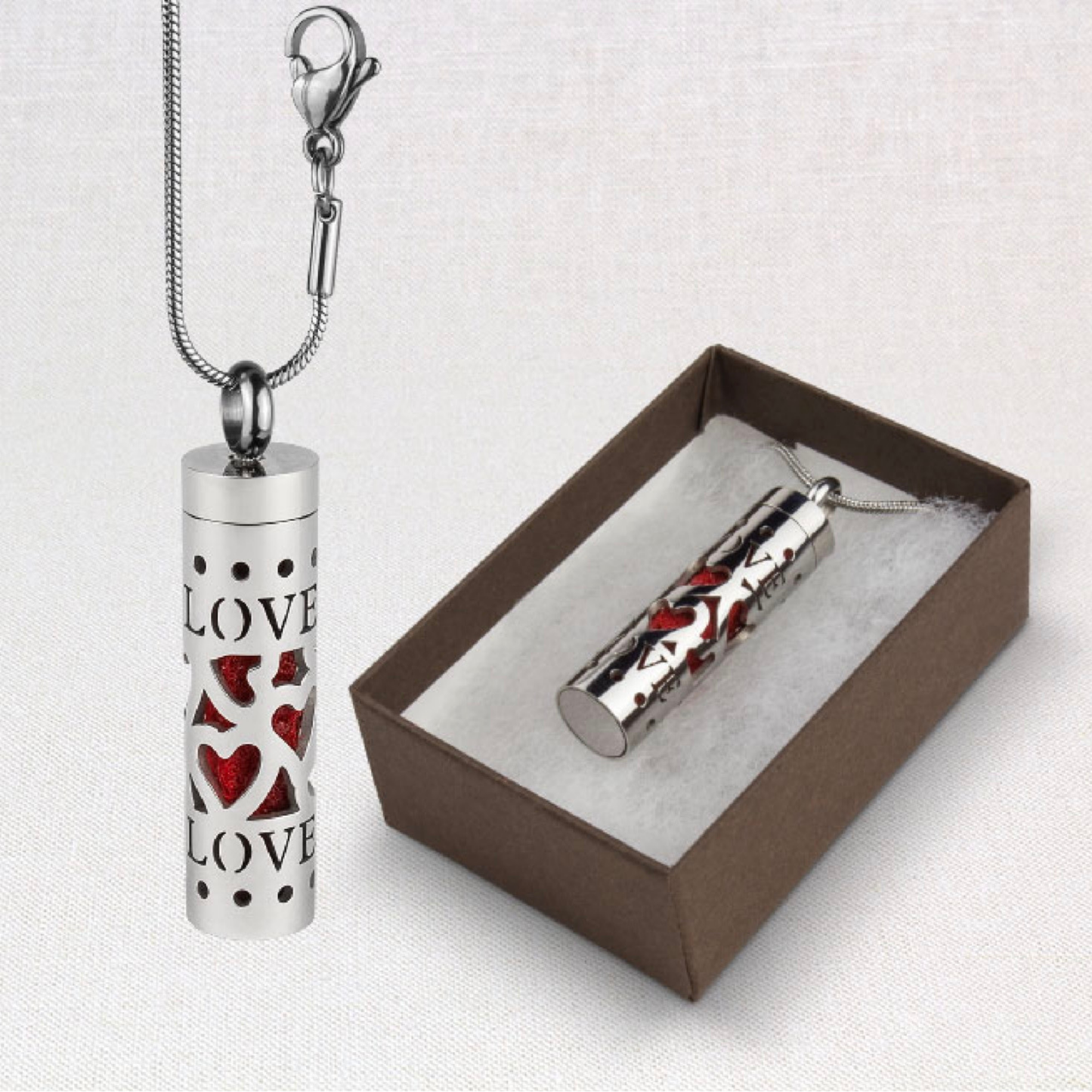 Aromatherapy Love Pendulum oil diffuser necklace shown hanging and in a presentation box on a white background.