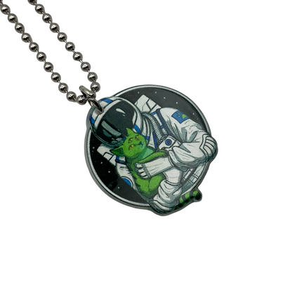 Necklace with an acrylic pendant featuring an astronaut and alien cat design on a white background