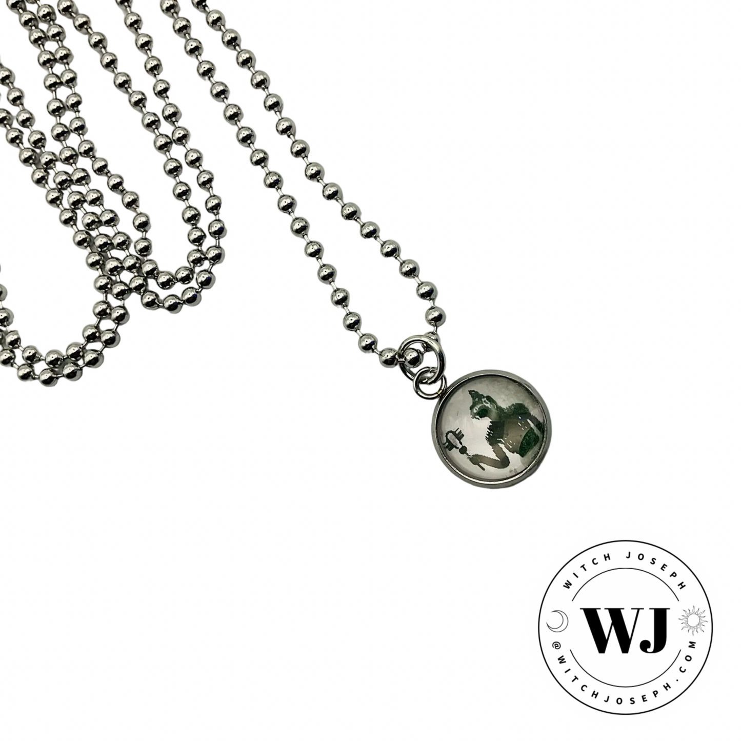 small Bastet charm necklace displayed against a white background with the Witch Joseph Logo