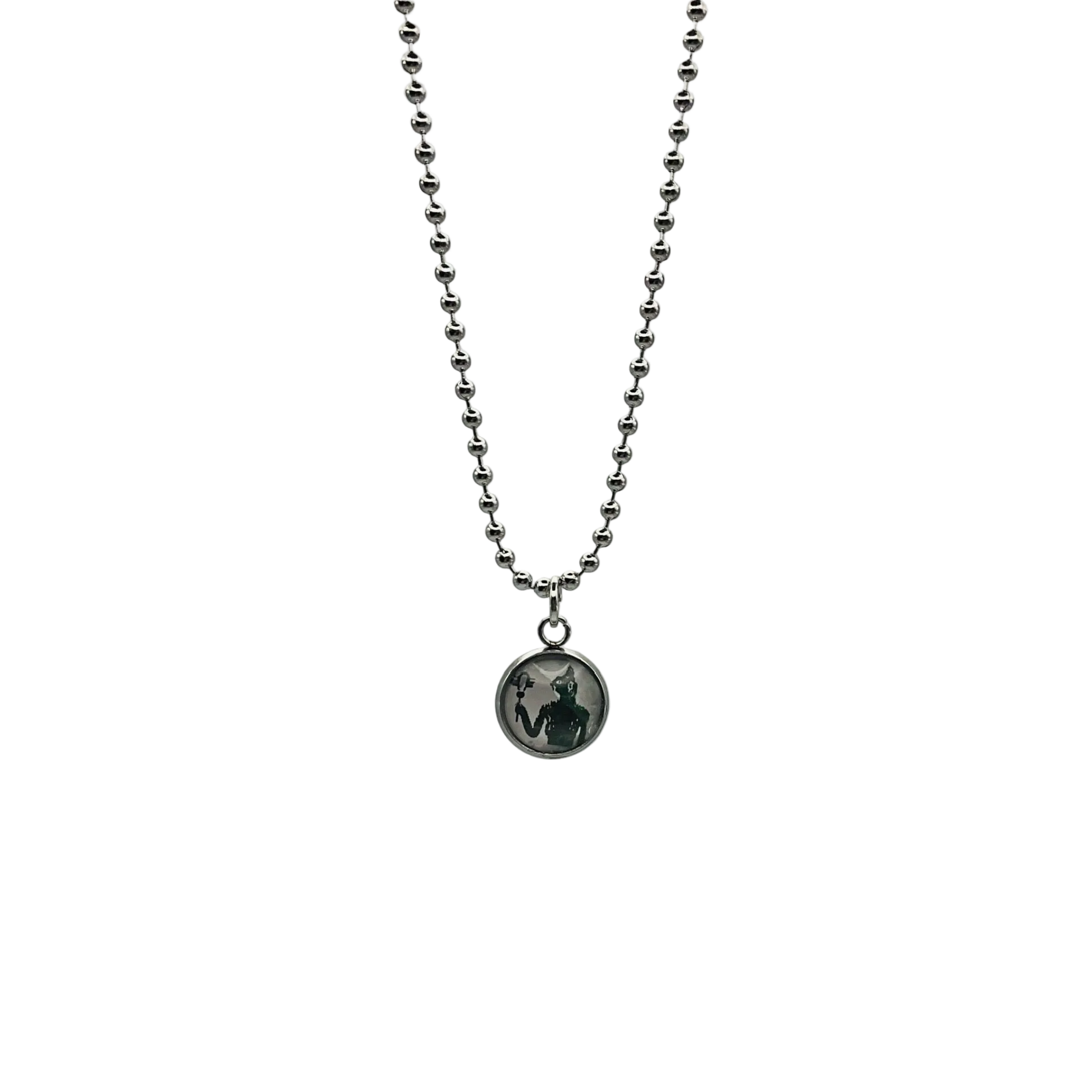 Silver tone Necklace with a round Bastet pendant on a white background.