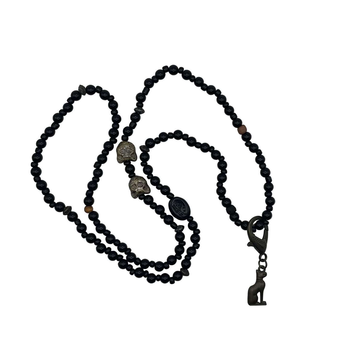 Black beaded necklace with decorative cat bead elements and a bronze tone Bastet cat pendant displayed on a white background