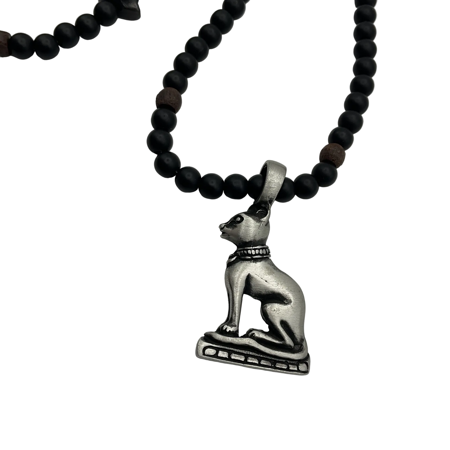 Bastet Necklace with black beads and other cat accent beads and a pewter cat pendant close up displayed on a white background