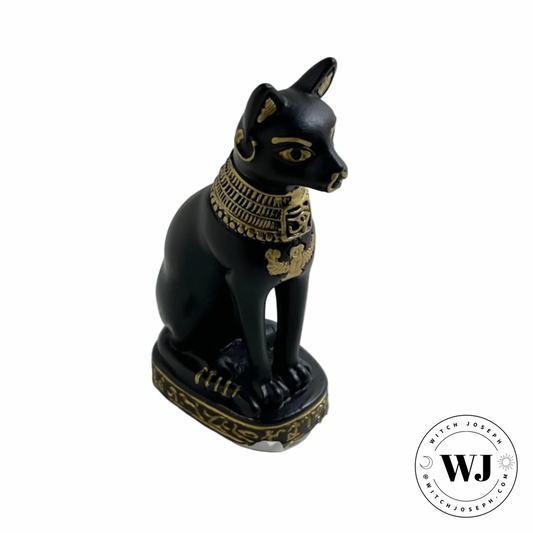 Black cat Bastet figurine with gold detailing on a white background, featuring the brand 'WJ'.