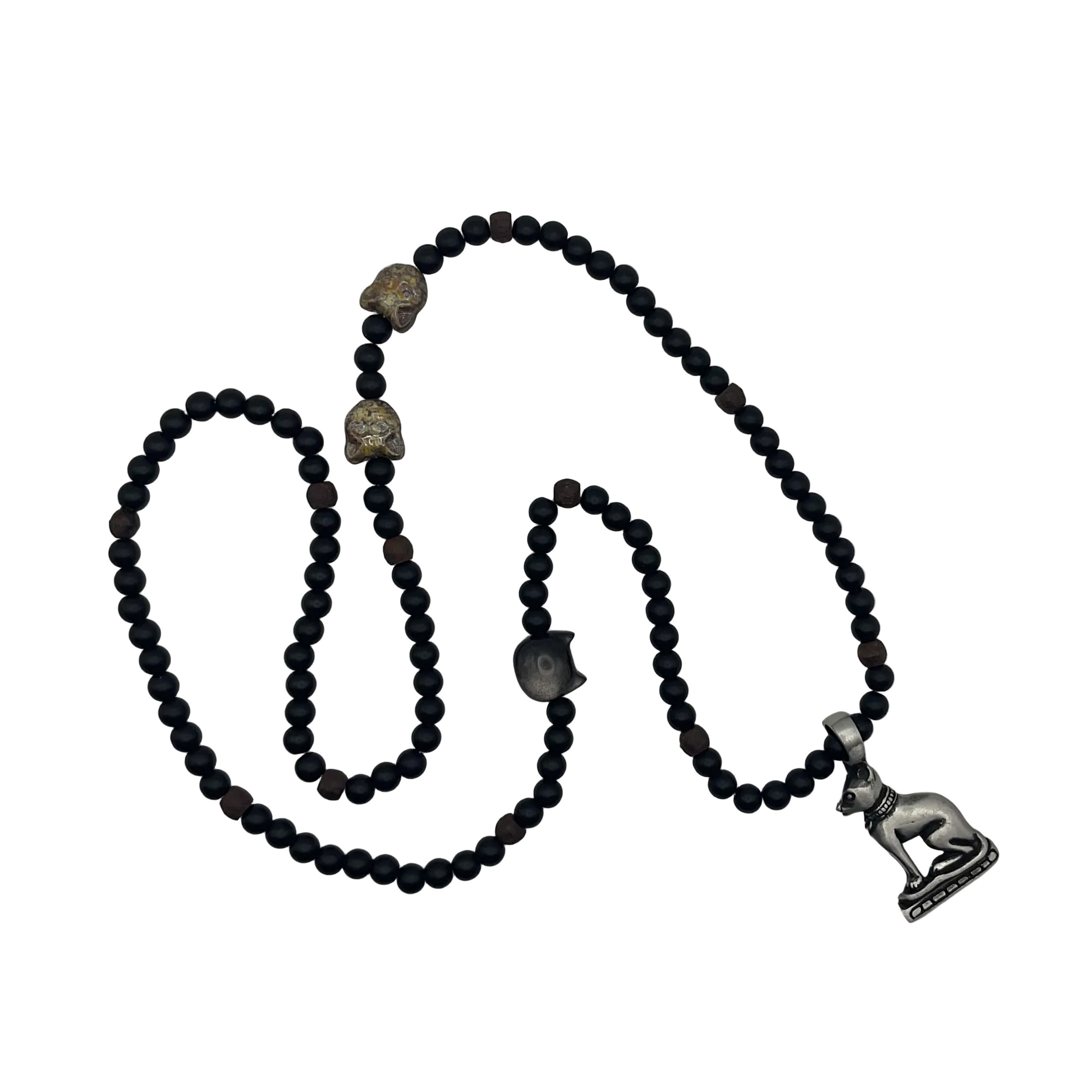 Black beaded necklace with cat beads and a silver obsidian cat bead with a pewter Cat Goddess pendant on a light white background