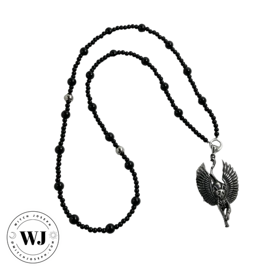 Prayer Beads dedicated to the Goddess Bastet with a main pendant of a winged Egyptian Bastet cat…displayed against a white background