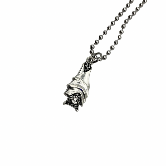 Silver tone hanging bat pendant on a ball chain against a white background