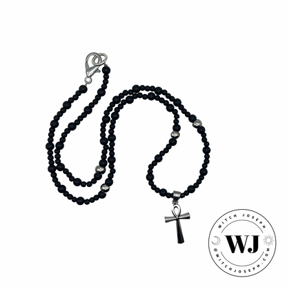Beaded Ankh Talisman with silver tone and black beads displayed against a white background with the Witch Joseph Logo