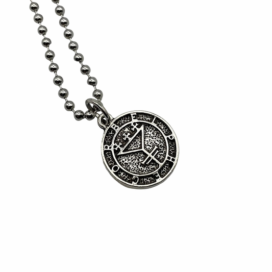 A silver tone round pendant with the sigil seal of Belphagor on it on a ball chain displayed against a white background
