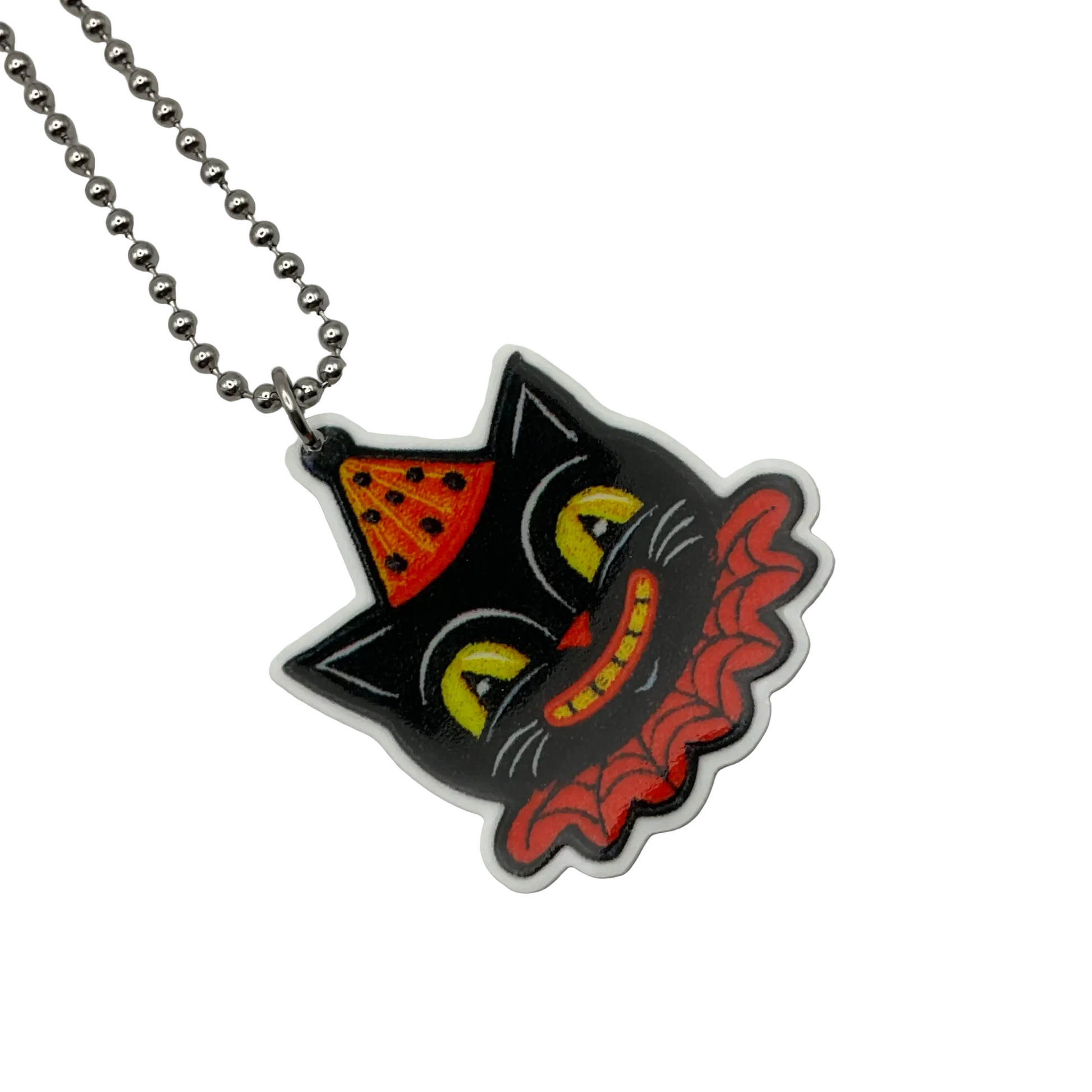Black cat head with a party hat and collar  acrylic pendant on a ball chain against a white background