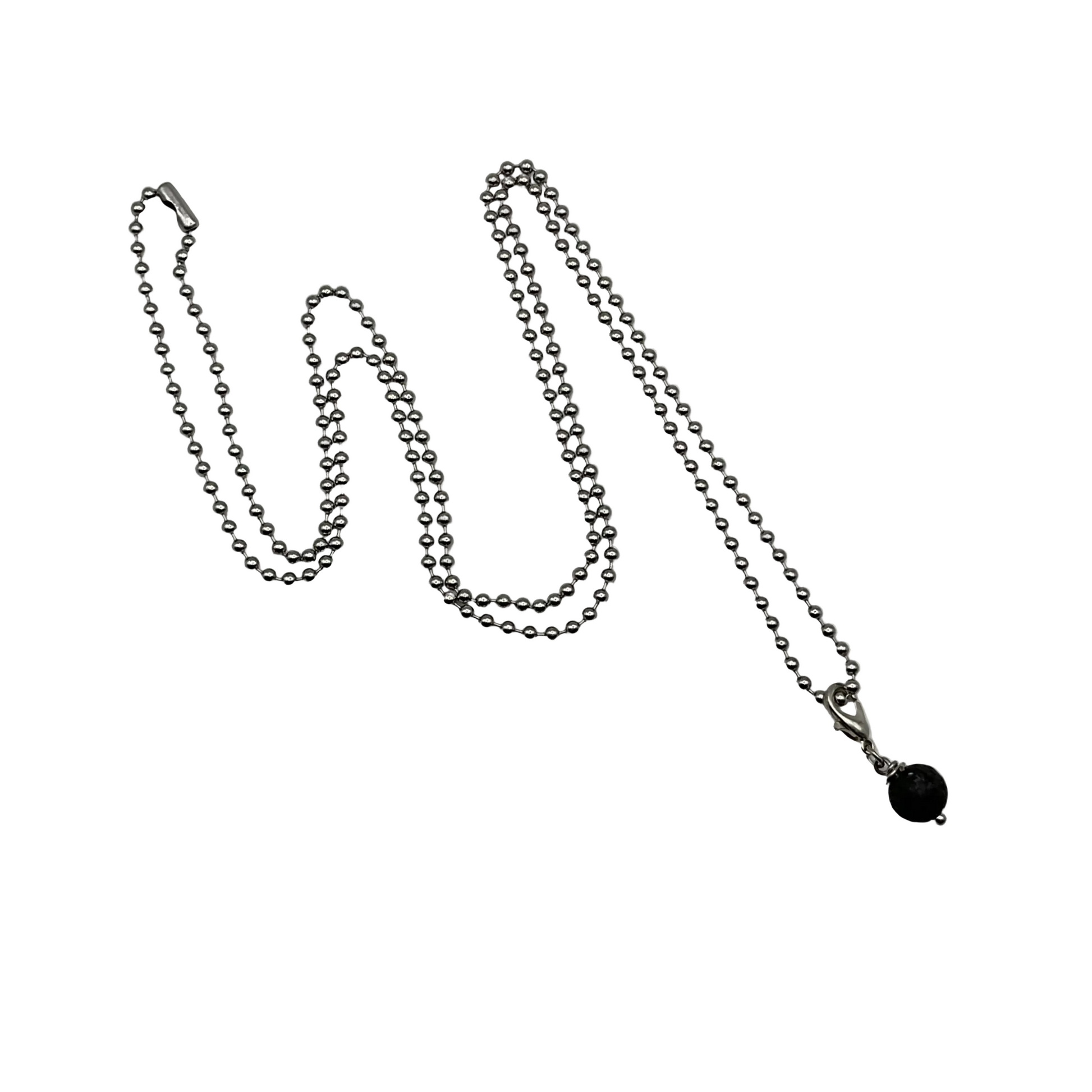 Silver tone ball chain necklace with a black lava stone pendant on a white background